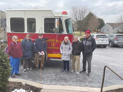 Photo of residents' committee posing with Keystone Fire in front of truck